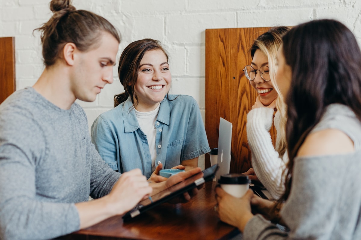 A small group talking together over coffee